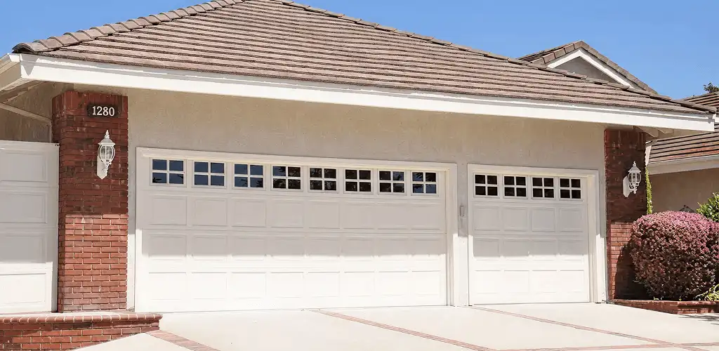Residential garage door repair service for a double garage door in Green Bay, WI