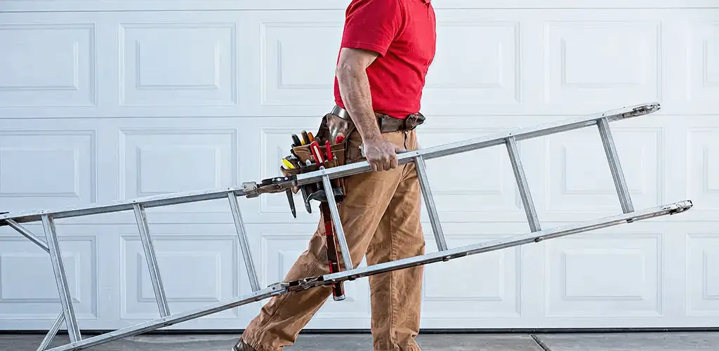 Garage door repair technician arriving with tools and ladder in Green Bay, WI