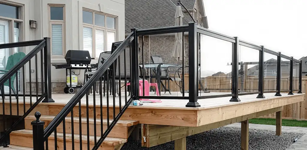 Handrail installation on a deck staircase for safety and code compliance in Green Bay, WI